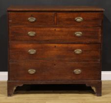 A George III oak chest, rectangular top with moulded edge above two short and three long drawers,