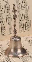A George V silver table bell, cast figural handle, 14cm high, Crisford & Norris, Birmingham 1911