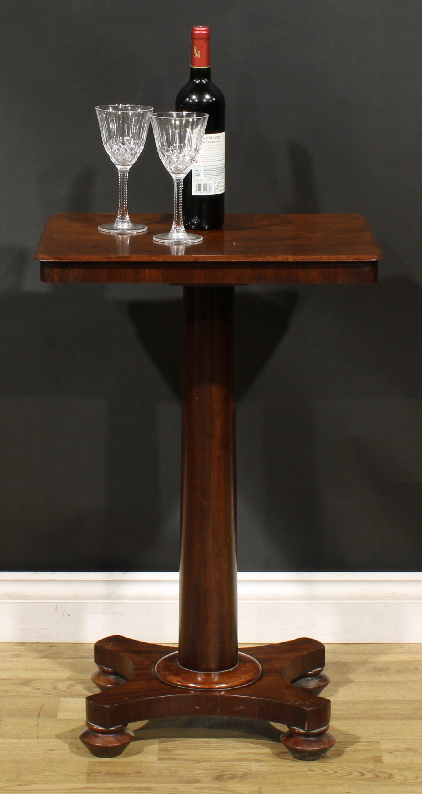 A George/William IV mahogany pedestal wine table, rounded rectangular top, cylindrical column,