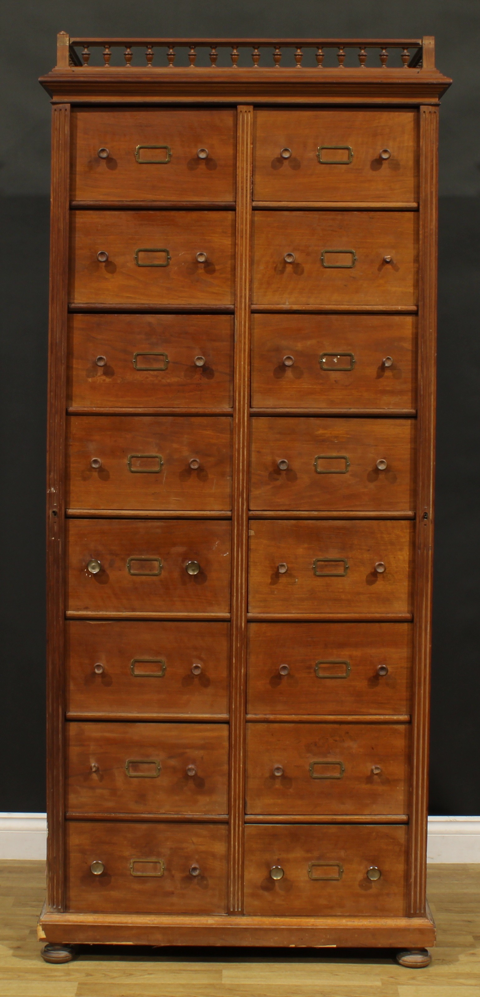 A late 19th century French walnut cartonnier, moulded cornice with balustrade gallery above