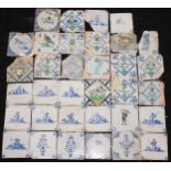 A collection of 18th and 19th century Delft tiles, including polychrome, figures, flora and fauna,