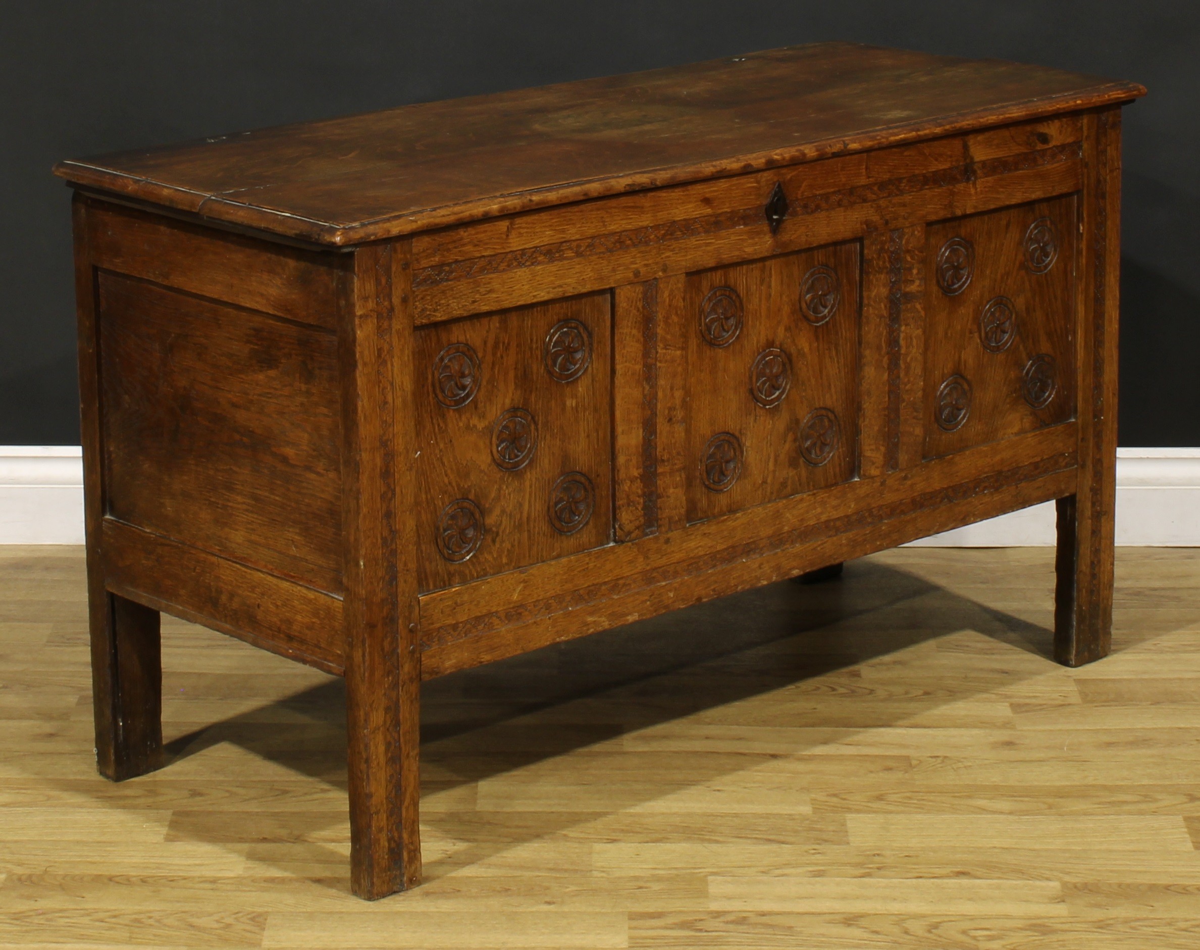 An 18th century oak blanket chest, hinged top enclosing a till above a three panel front, carved - Image 2 of 5