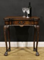 A George II Revival Irish mahogany card table, hinged hipped rectangular top enclosing an inset