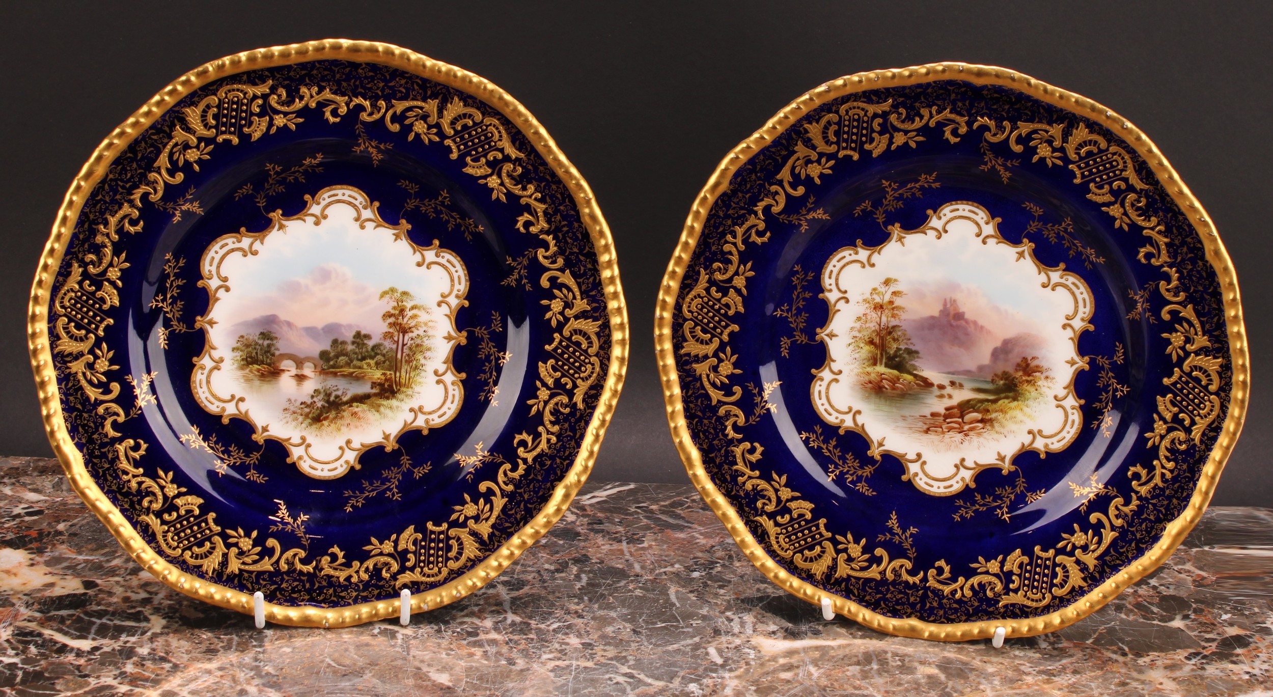 A pair of Coalport Named View shaped circular plates, Weir Bridge and 'Thornden', each painted