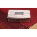 A large William IV silver waisted rectangular snuff box, reeded overall, hinged cover, gilt