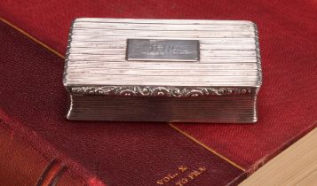 A large William IV silver waisted rectangular snuff box, reeded overall, hinged cover, gilt
