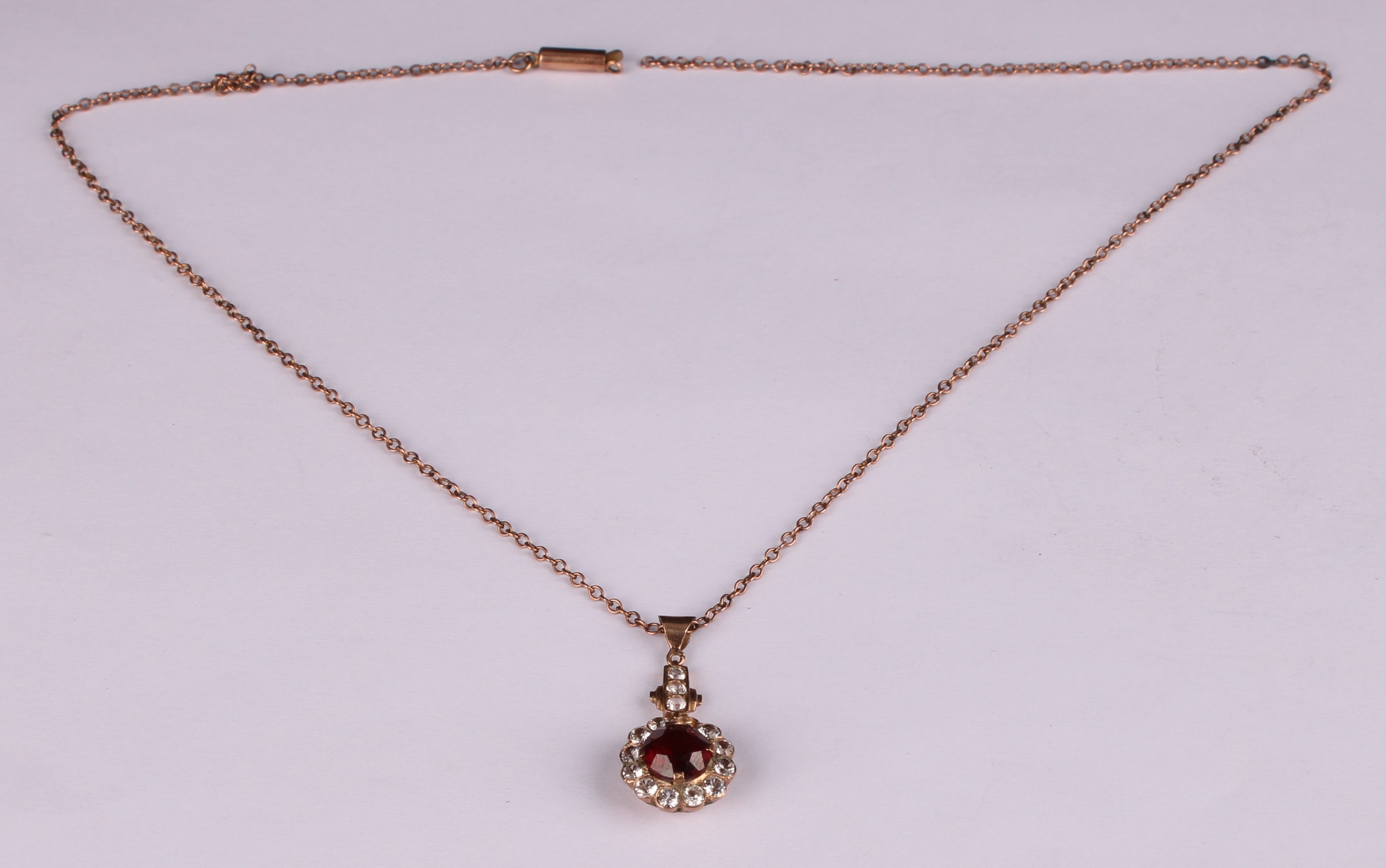 A red garnet and white stone cluster pendant, rose metal mount, suspended from a 9ct gold chain, - Image 2 of 5