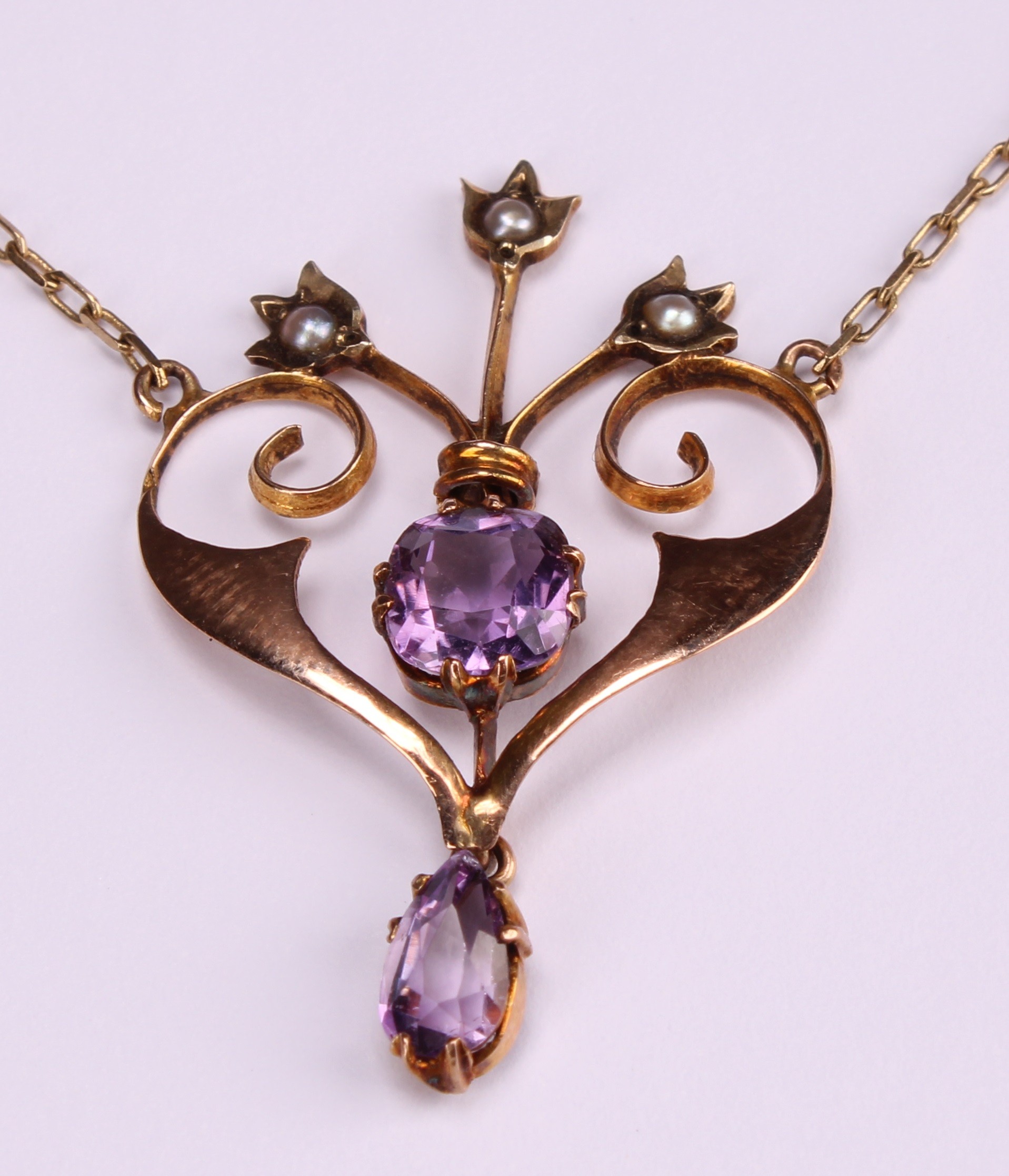 An Art Nouveau amethyst and split pearl scrolling heart pendant necklace, 9ct gold mount and - Image 4 of 4