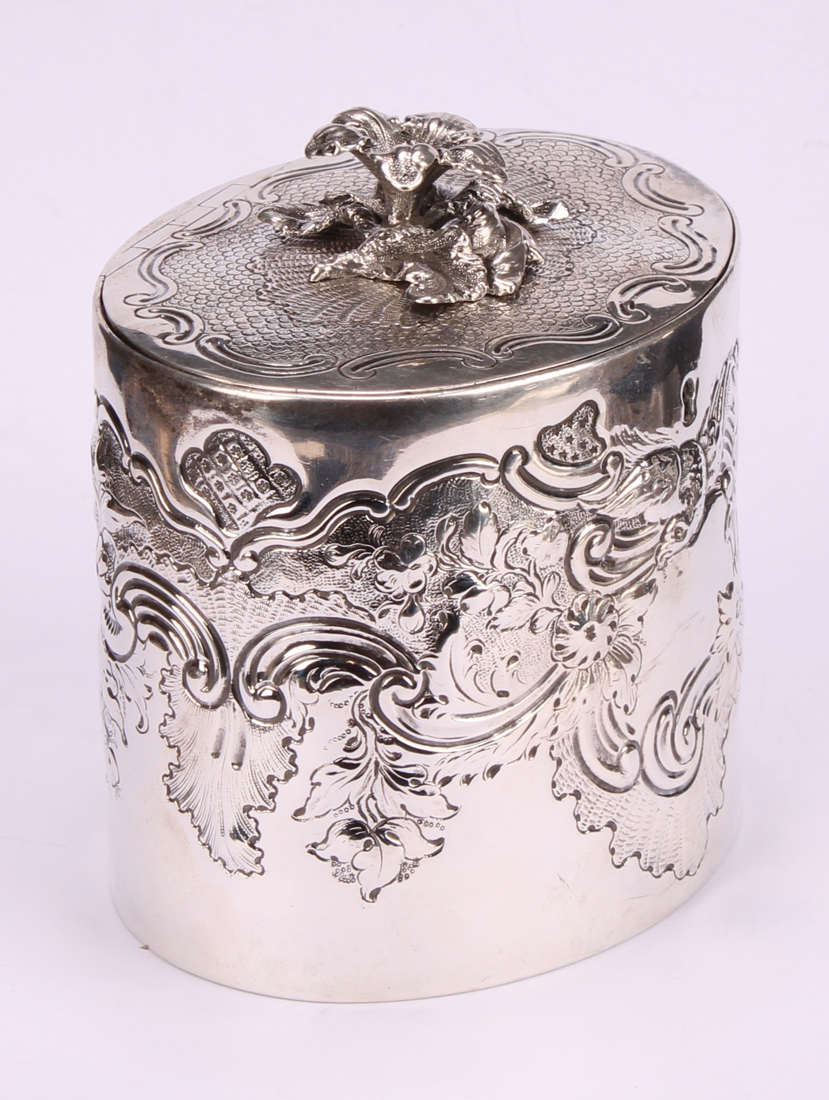 A George III oval tea caddy, chased with birds, flowers and scrolling leaves, flush-hinged cover - Image 3 of 5