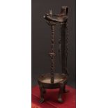A 19th century wrought iron whale oil lamp, cut steel pillar, 37cm high