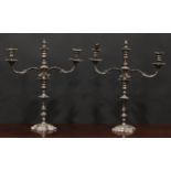 A pair of George II design E.P. on copper three-light table candelabra, knopped pillars, shaped