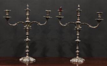A pair of George II design E.P. on copper three-light table candelabra, knopped pillars, shaped