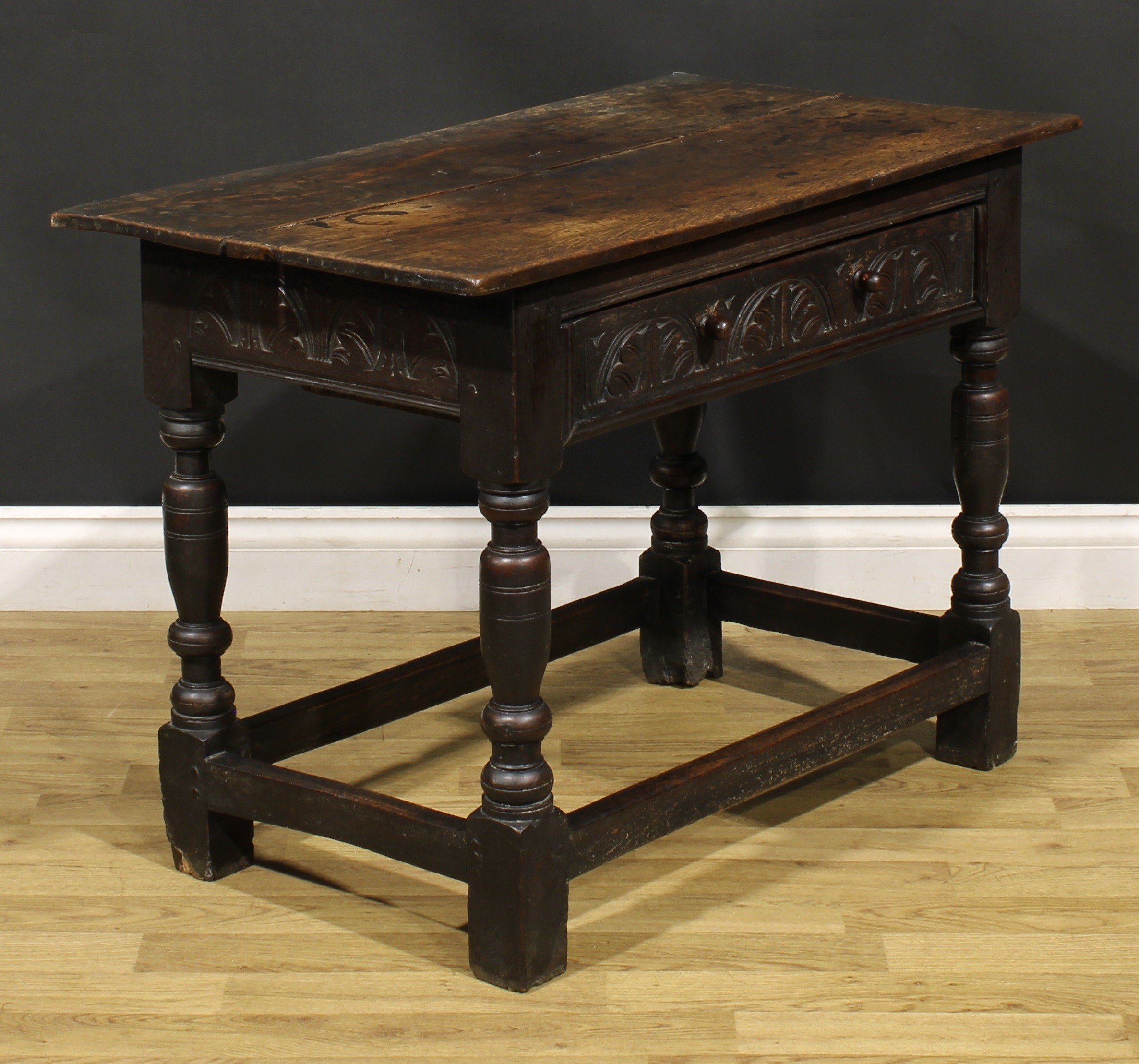 A 17th century oak side table, oversailing top above a long frieze drawer carved with leafy - Image 3 of 6
