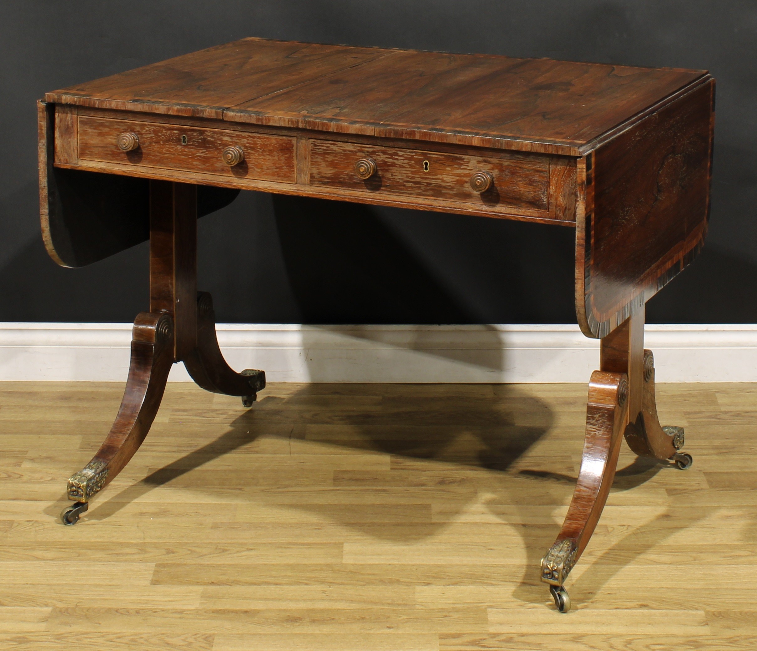 A Regency rosewood sofa table, crossbanded rounded rectangular top with fall leaves, above a pair of - Image 6 of 7