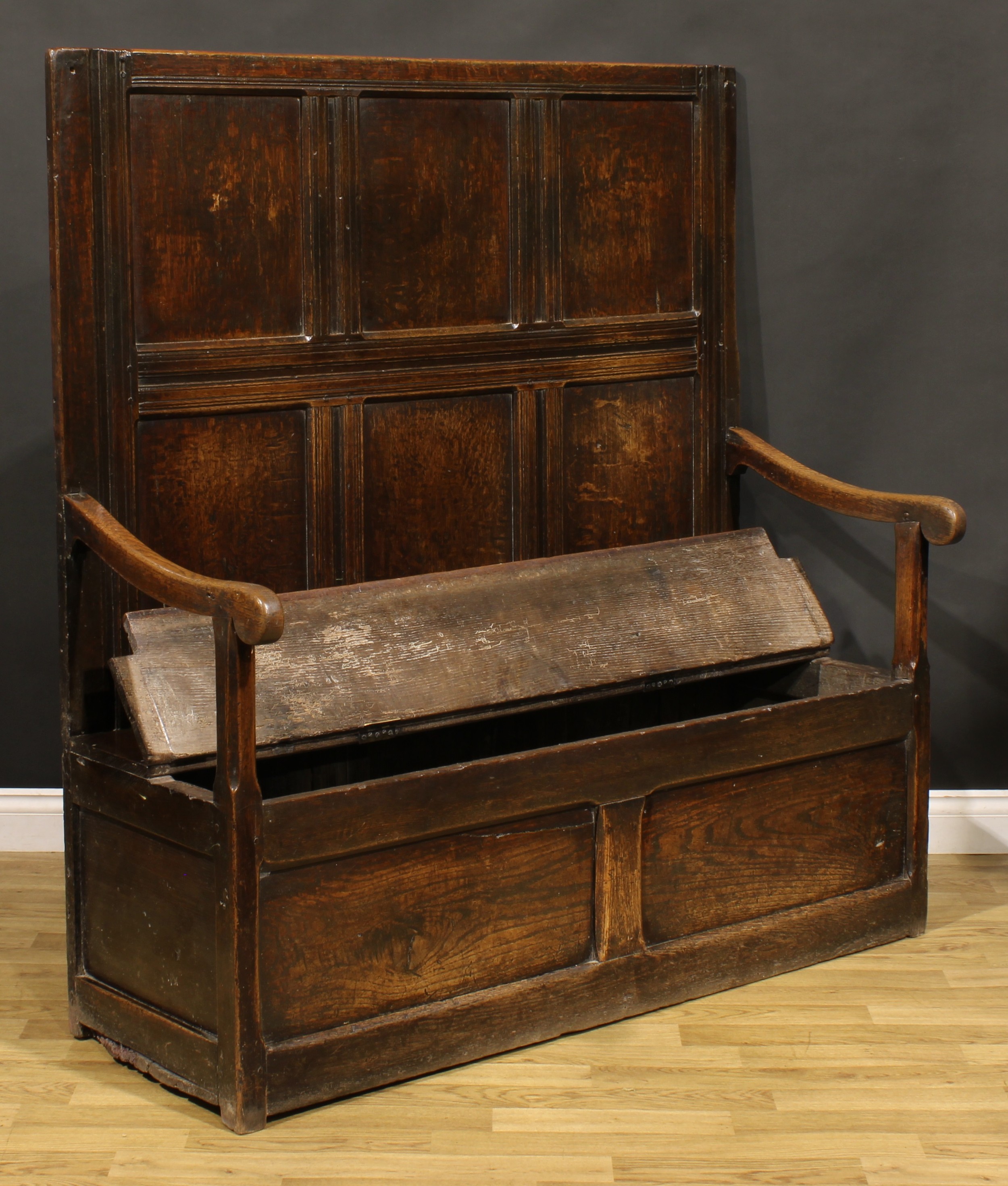 An 18th century oak box settle, rectangular panel back, hinged seat, 147cm high, 140cm wide, the - Image 3 of 4