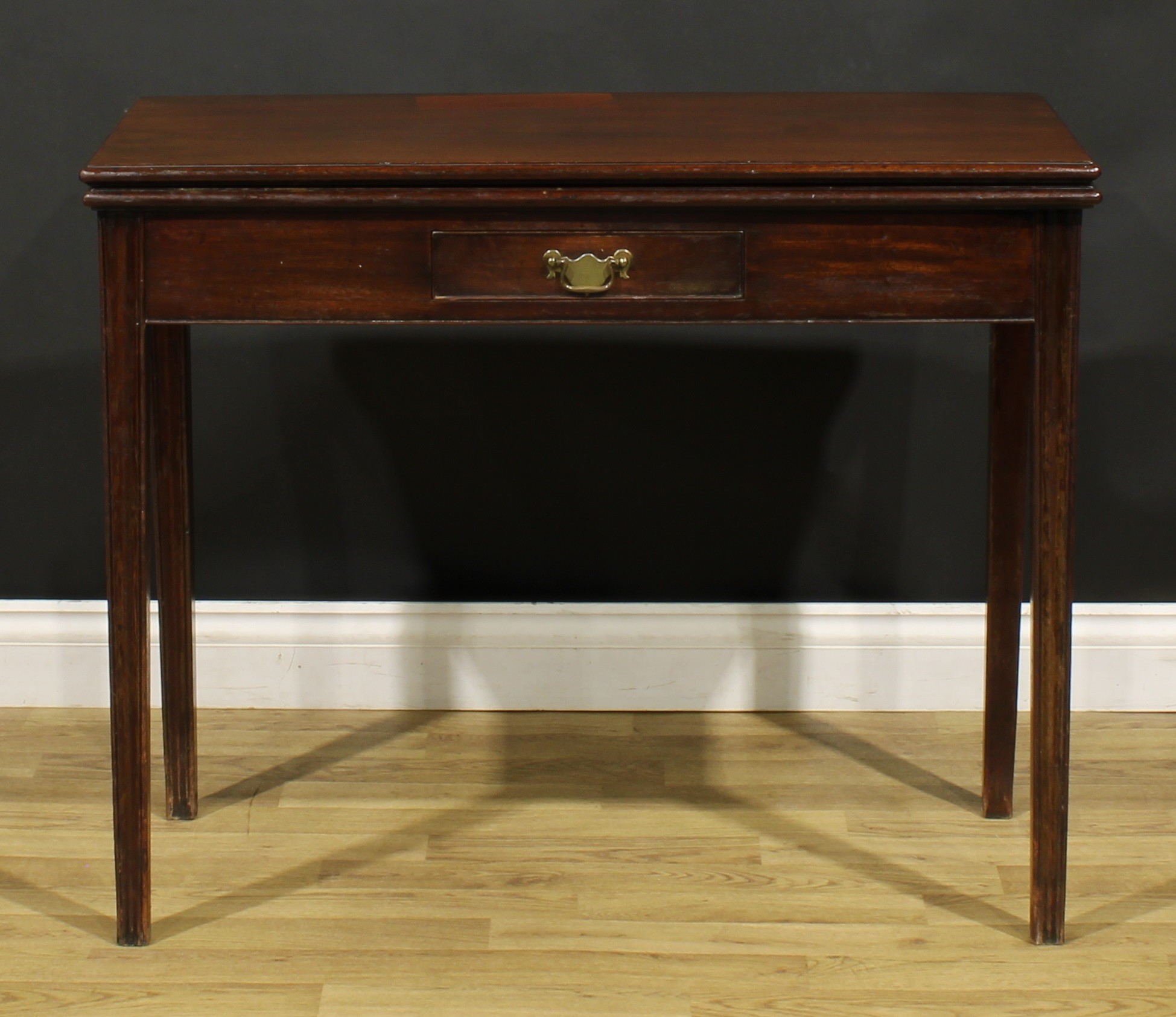 A George III mahogany card table, hinged top with moulded edge enclosing a baize lined playing - Image 2 of 7