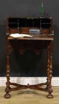 A William & Mary design walnut bureau, of small proportions, fall front enclosing a stepped