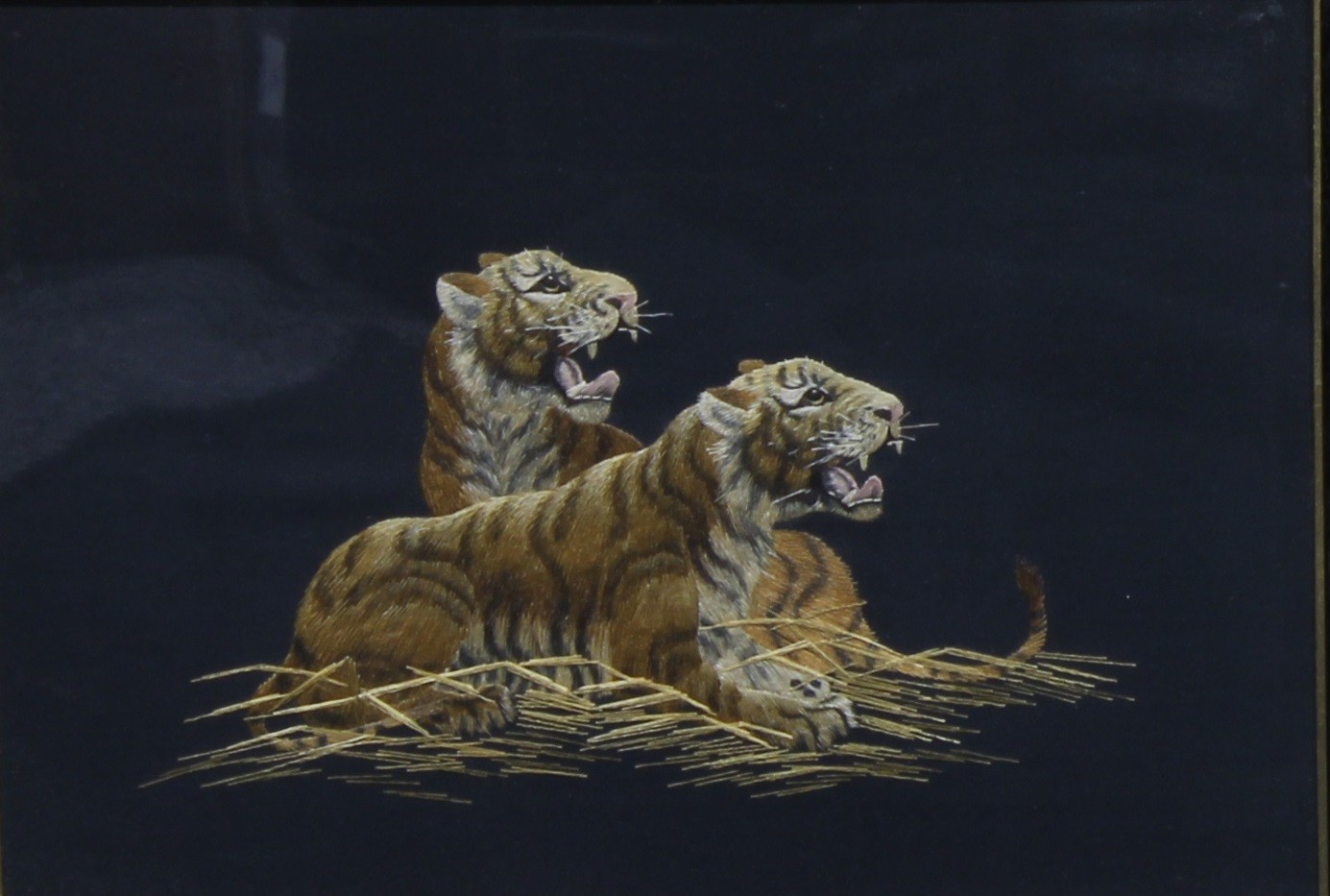 A pair of Japanese silk pictures, depicting tigers, and a lion and cub, 26.5cm x 37cm, oak frames, - Image 2 of 4