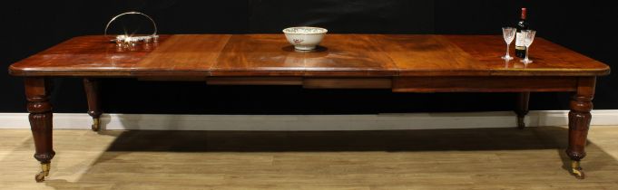 A William IV mahogany extending dining table, rounded rectangular top, four additional leaves,