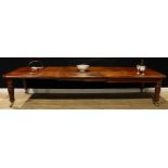 A William IV mahogany extending dining table, rounded rectangular top, four additional leaves,