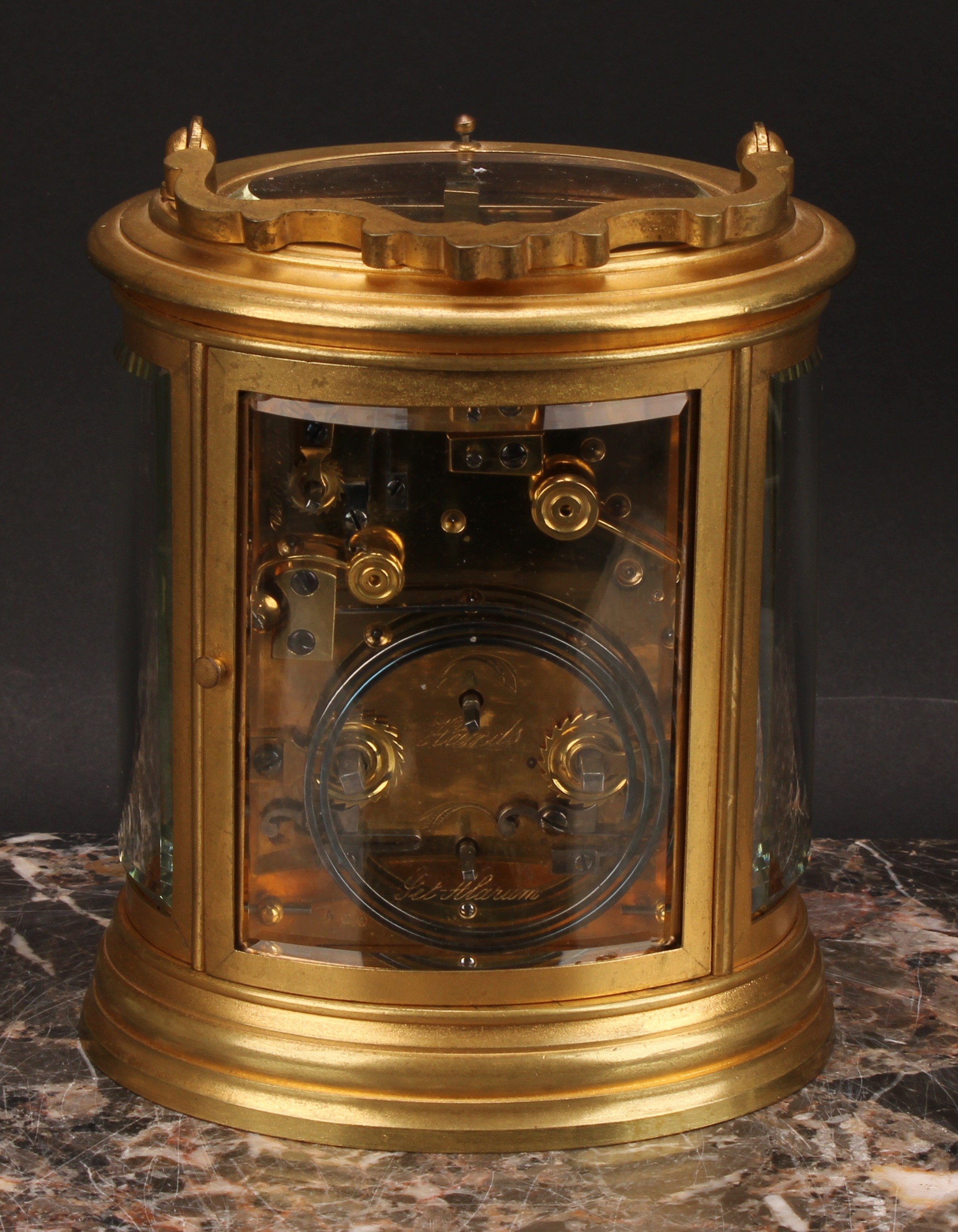 A late 19th century gilt brass oval repeating alarum carriage clock, 7cm enamel dial with Roman - Image 5 of 7