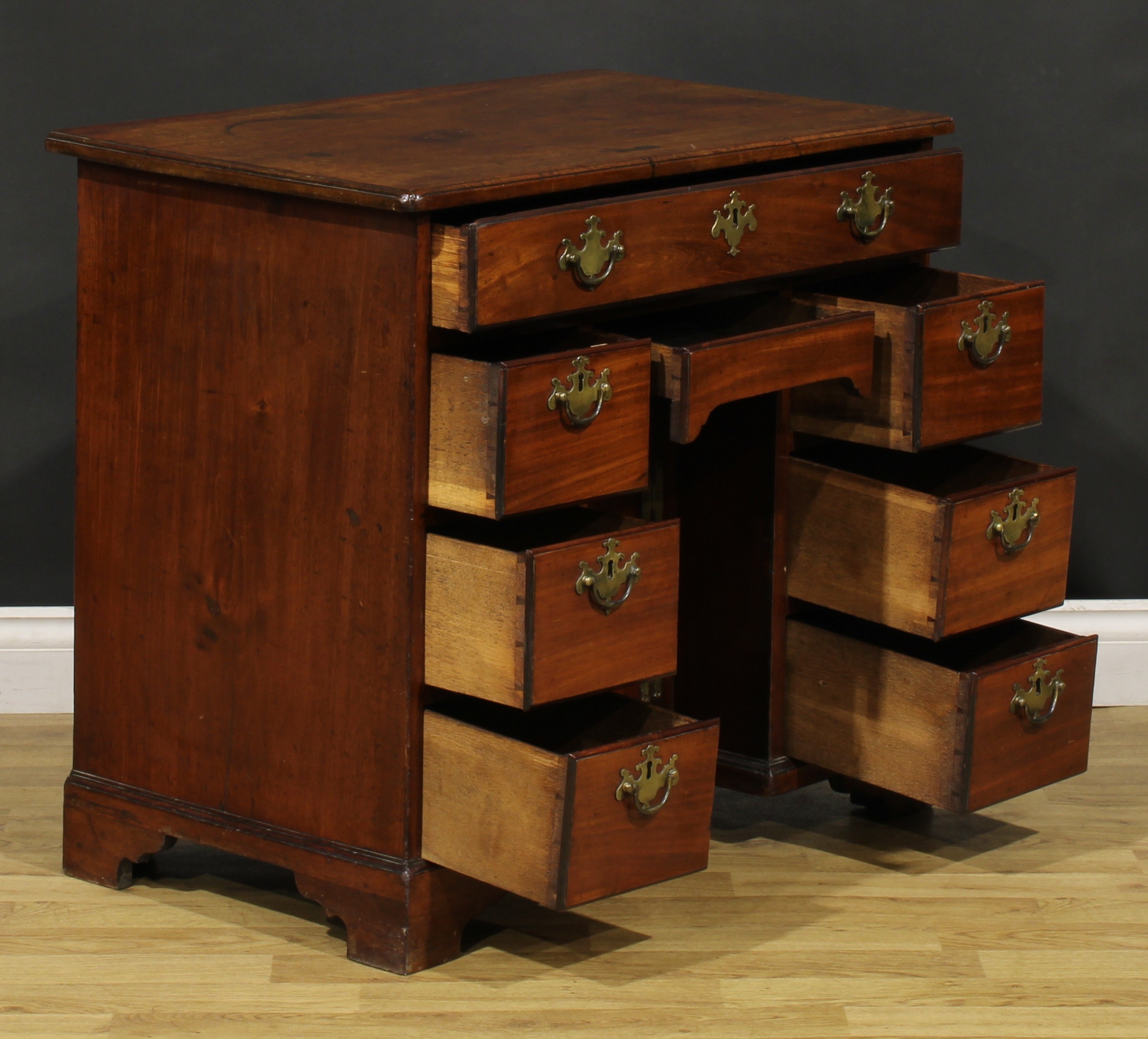 A George III mahogany kneehole desk, slightly oversailing top above an arrangement of eight drawers, - Image 4 of 6