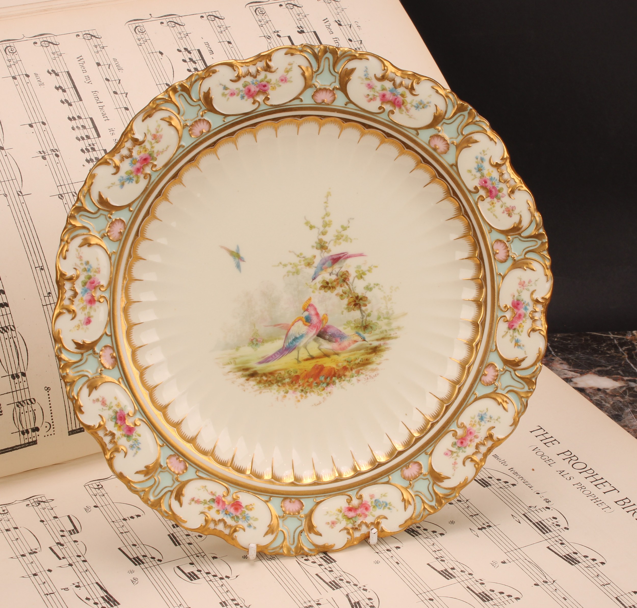 A Royal Crown Derby shaped circular cabinet plate, painted by Joseph Arthur Peach (1864 - 1951),