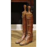 A pair of 19th century country gentleman's tan leather knee length riding boots, with beech boot