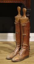 A pair of 19th century country gentleman's tan leather knee length riding boots, with beech boot