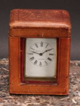 An early 20th century brass carriage timepiece, of small proportions, 4cm rectangular enamel clock