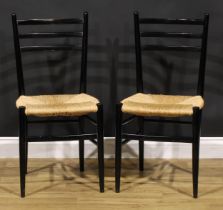 A pair of mid-20th century Italian ebonised beech side chairs, in the manner of Gio Ponti’s