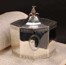 A George III silver octagonal tea caddy, flush-hinged cover with pine apple finial, bright-cut