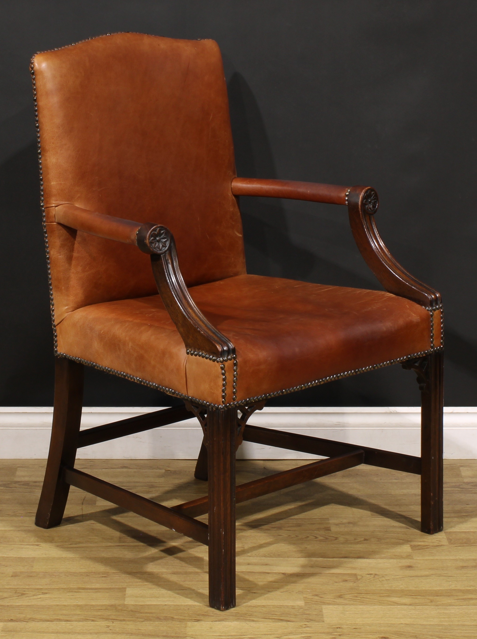A Chippendale Revival mahogany Gainsborough armchair, stuffed-over leather upholstery, the hand - Image 2 of 4