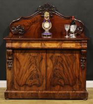 A Victorian flame mahogany buffet serving cabinet or sideboard, slightly oversailing top with shaped