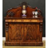 A Victorian flame mahogany buffet serving cabinet or sideboard, slightly oversailing top with shaped