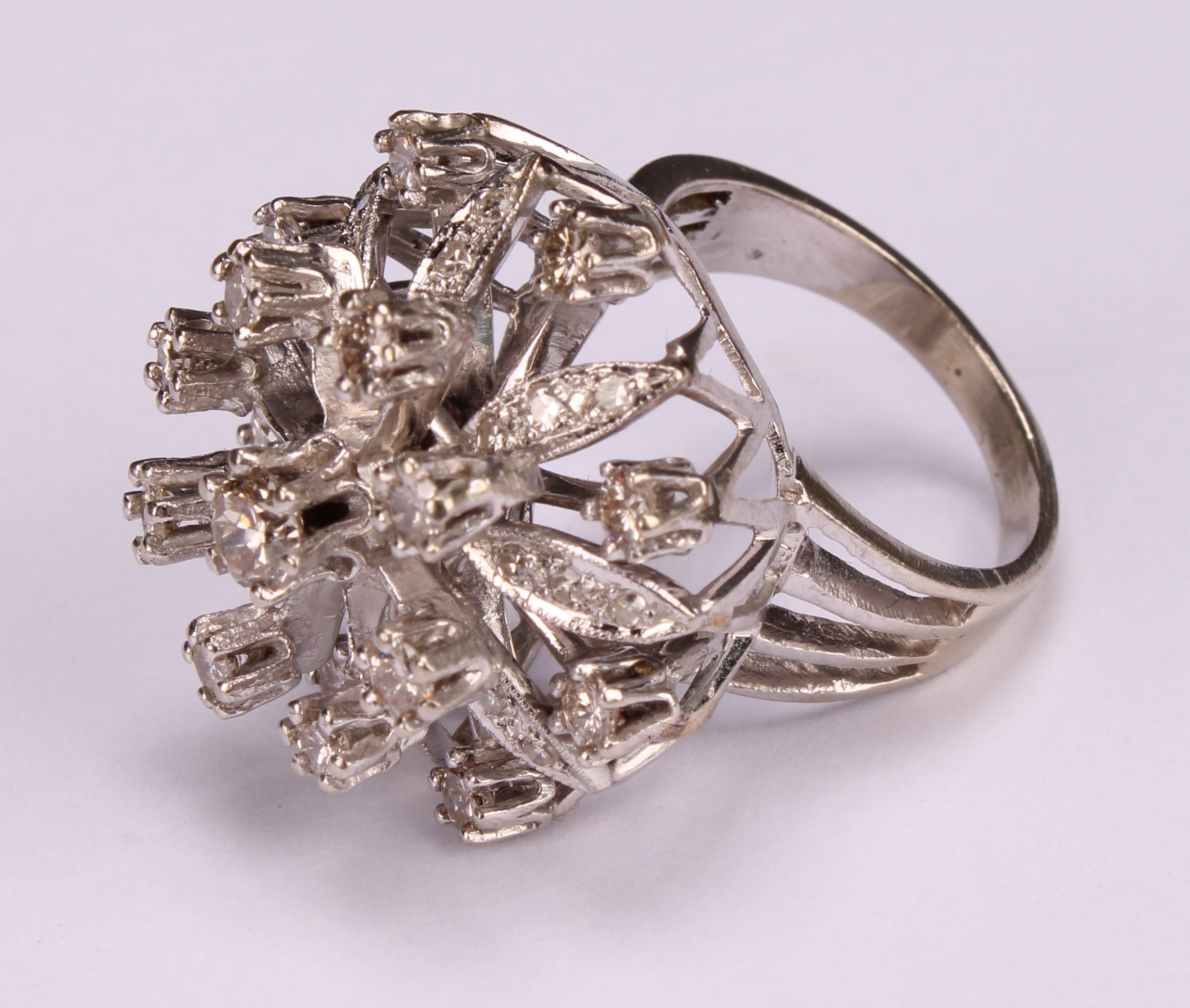 A large and impressive flowerhead diamond cluster ring, the central round brilliant cut stone within - Image 3 of 4