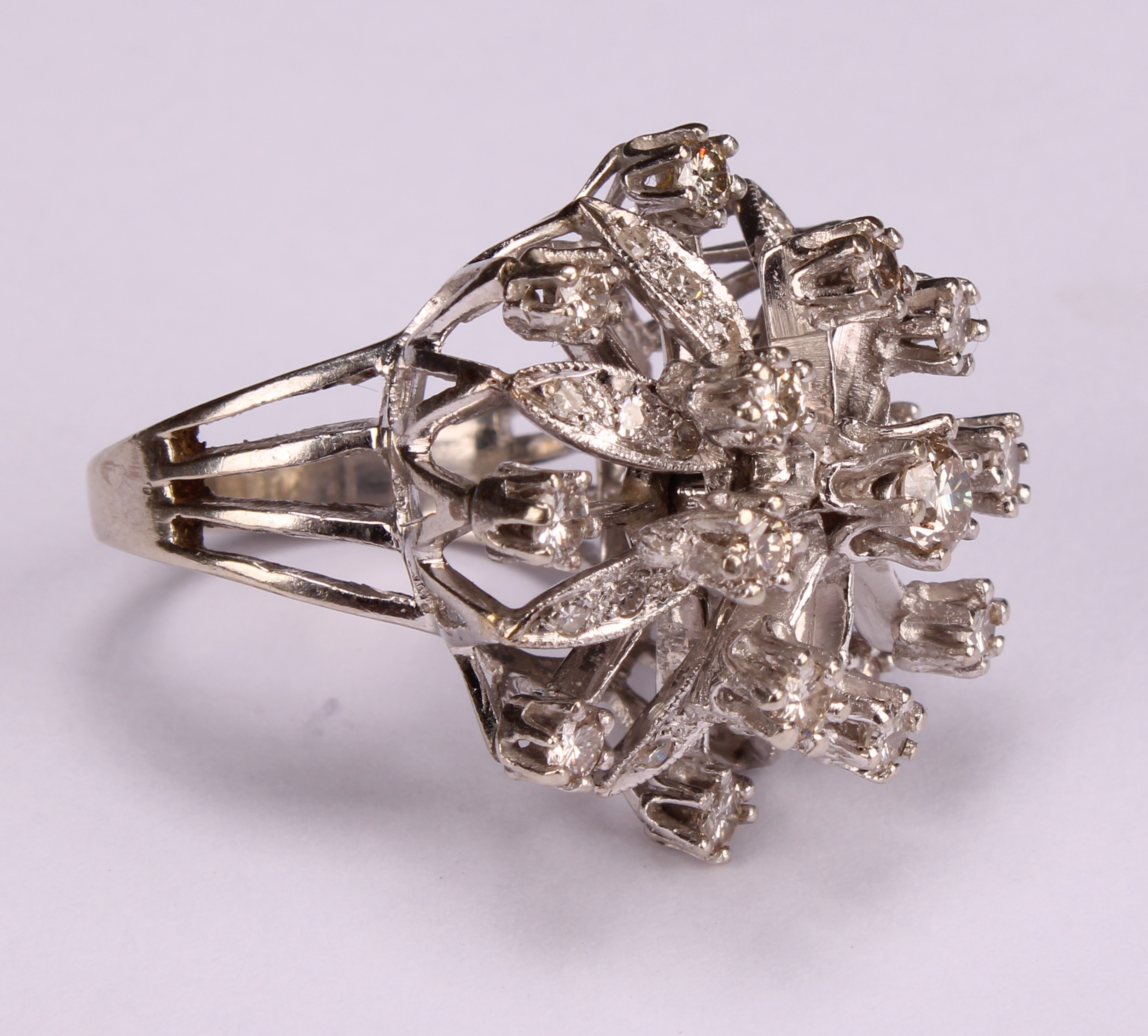 A large and impressive flowerhead diamond cluster ring, the central round brilliant cut stone within - Image 2 of 4