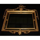 An Adam Revival giltwood and gesso chimney glass, rectangular mirror plate, the gadrooned frame