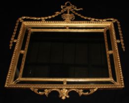 An Adam Revival giltwood and gesso chimney glass, rectangular mirror plate, the gadrooned frame
