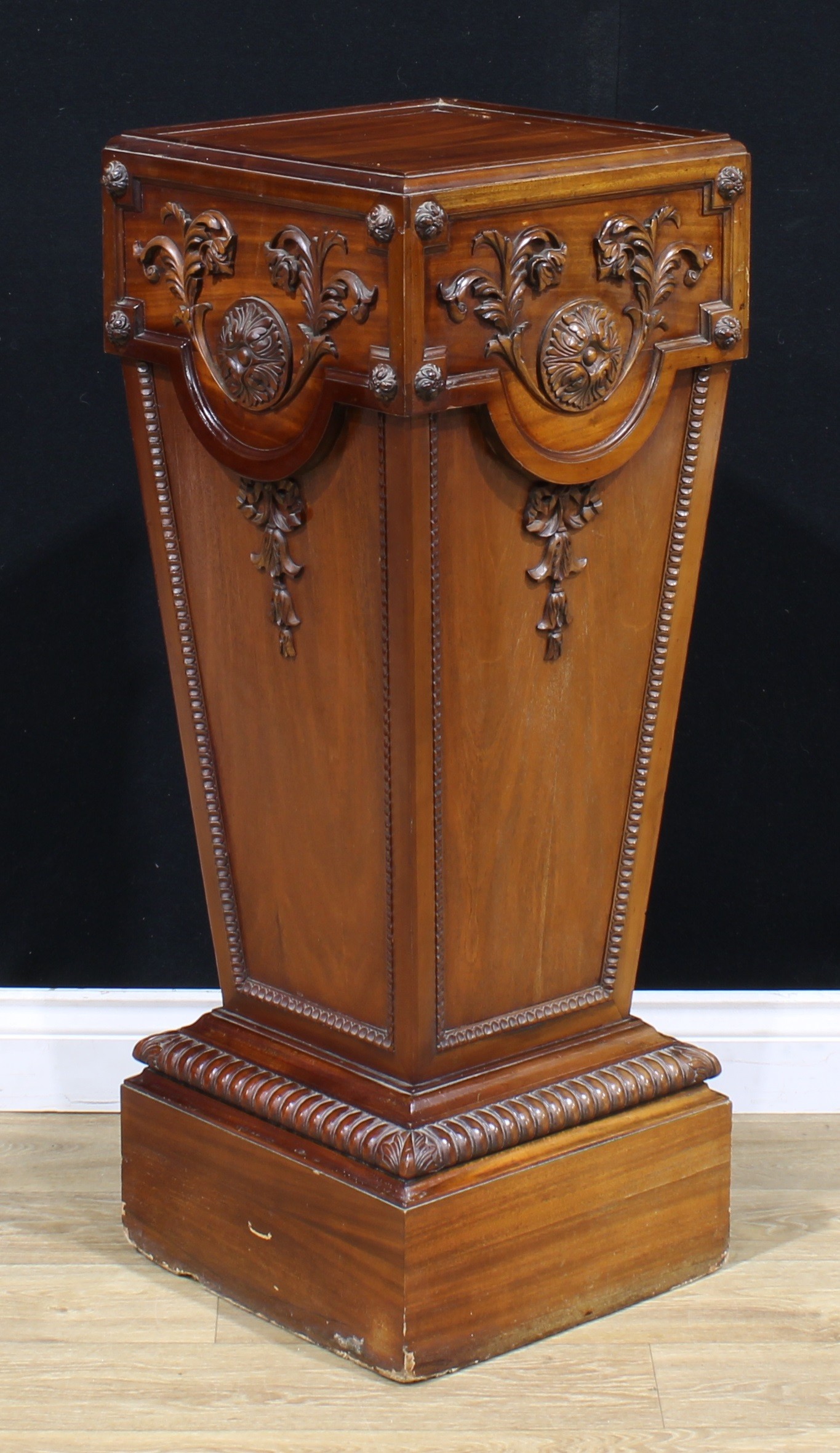 An Adam style mahogany statuary pedestal, carved and applied with bosses, leafy scrolls and bell - Image 3 of 3