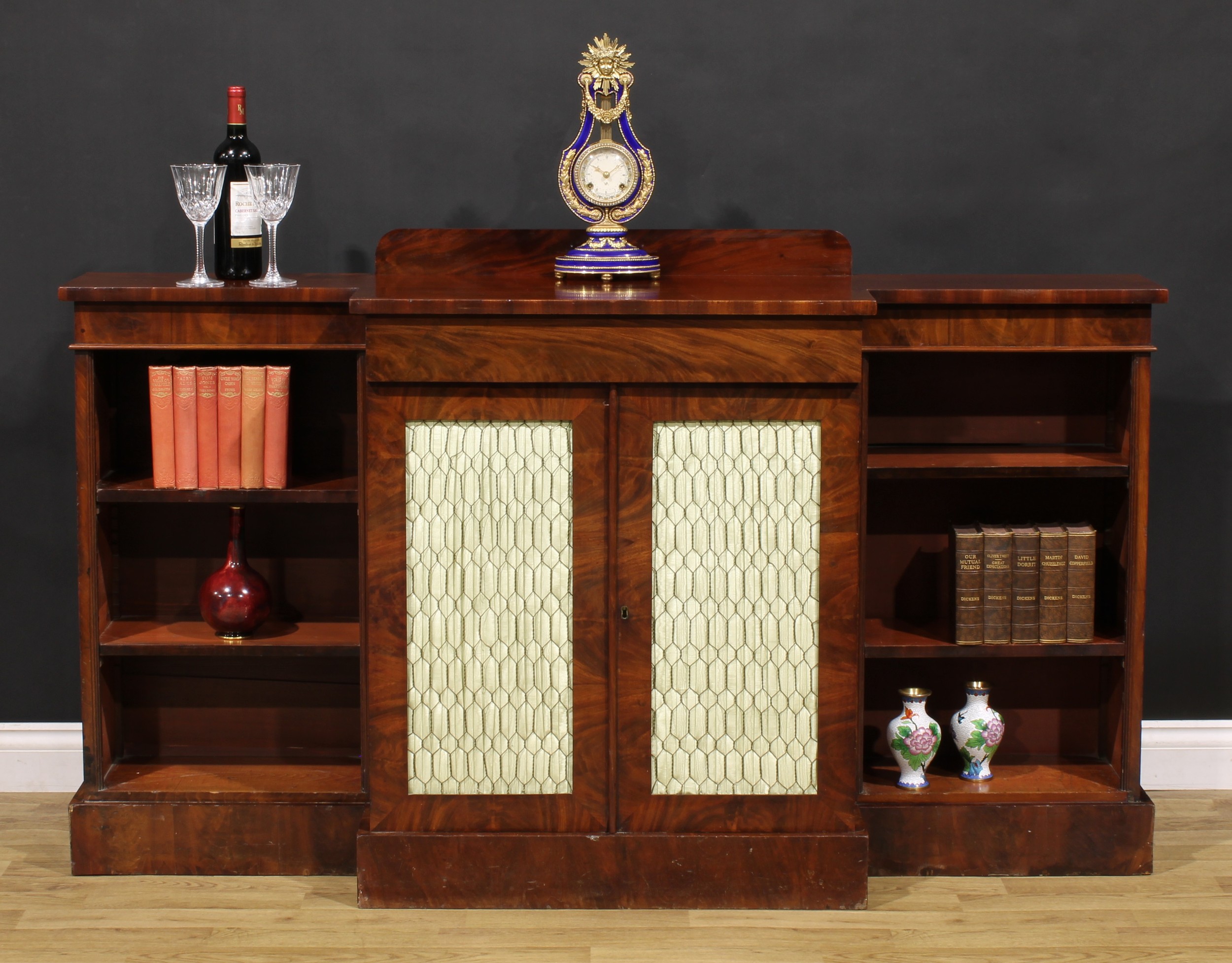 A Post-Regency mahogany break-centre low library bookcase, by J. Russell, upholsterer, cabinet