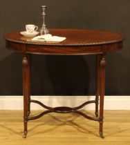 An Edwardian mahogany oval centre table, crossbanded oval top with gadrooned edge, reeded-pear