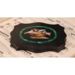 An Italian Grand Tour micro-mosaic cartouche shaped black marble desk weight, decorated in