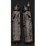 A pair of Post-Angkorian type softwood Buddha statues, possibly Cambodian, the largest 146cm high,