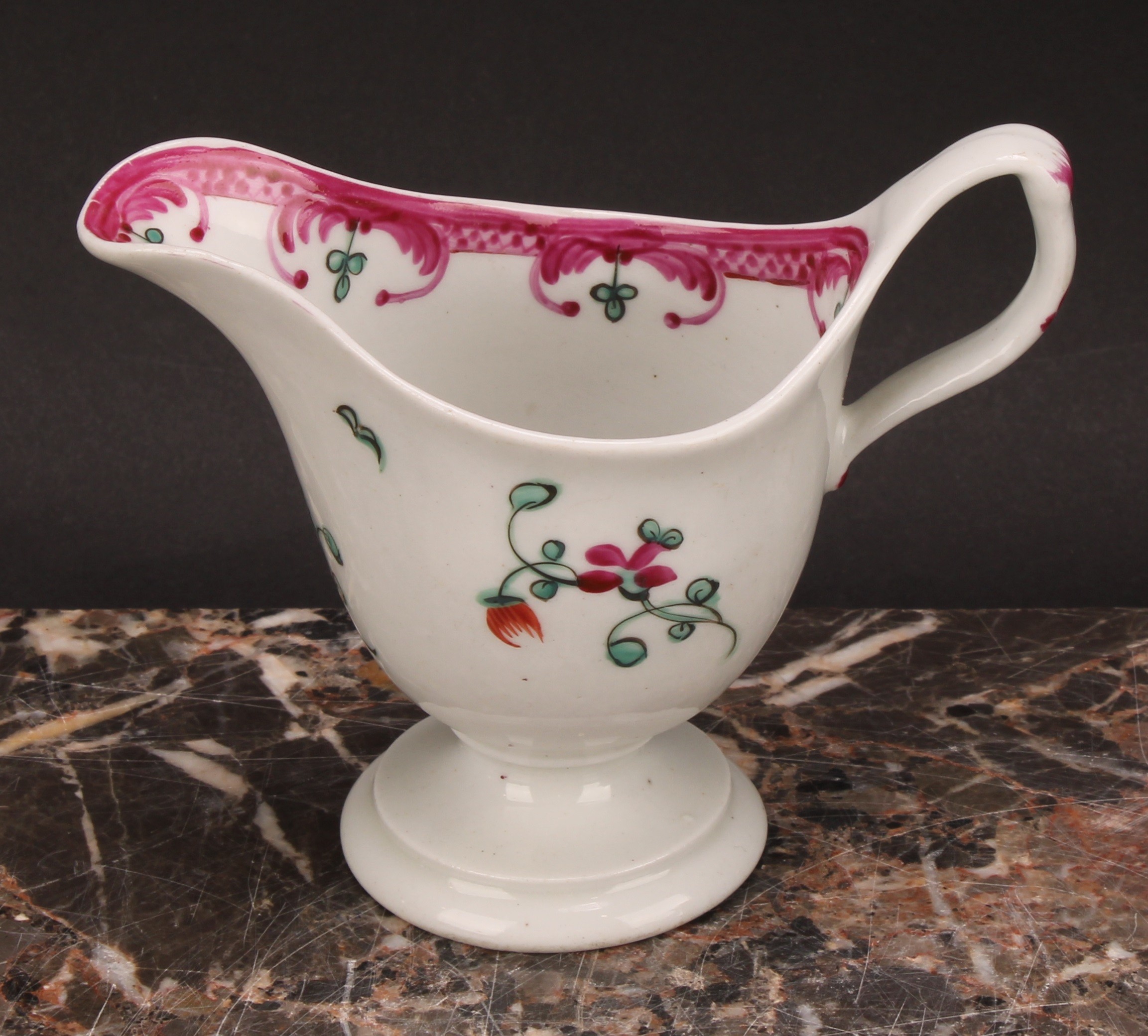 A Newhall helmet shaped cream jug, painted with scattered flowers, the interior with stylised floral - Image 11 of 12