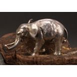 A German cast silver model, of an elephant, 14cm long, halbmond und krone mark, 800 standard,