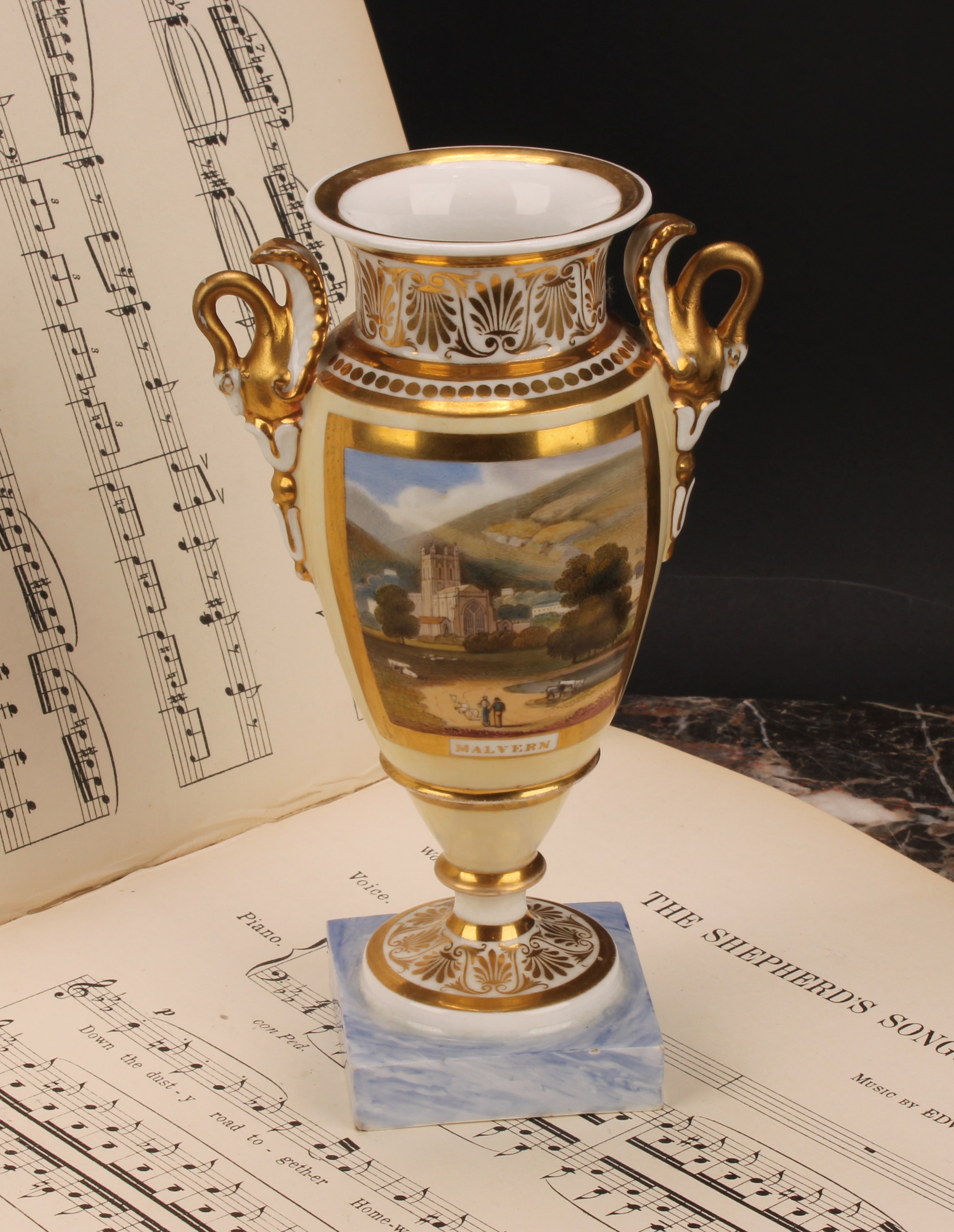 A Chamberlains Worcester named view urnular vase, the painted view within broad gilt border,