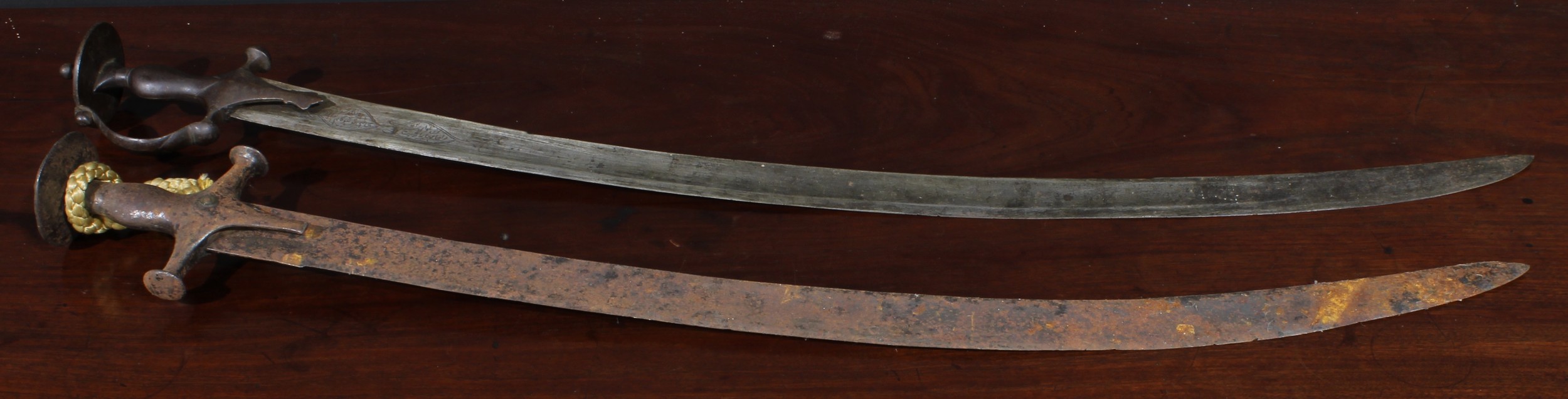 A 19th century Indian talwar, 81cm curved blade inscribed with two panels of verse, bowed knuckle - Image 2 of 3