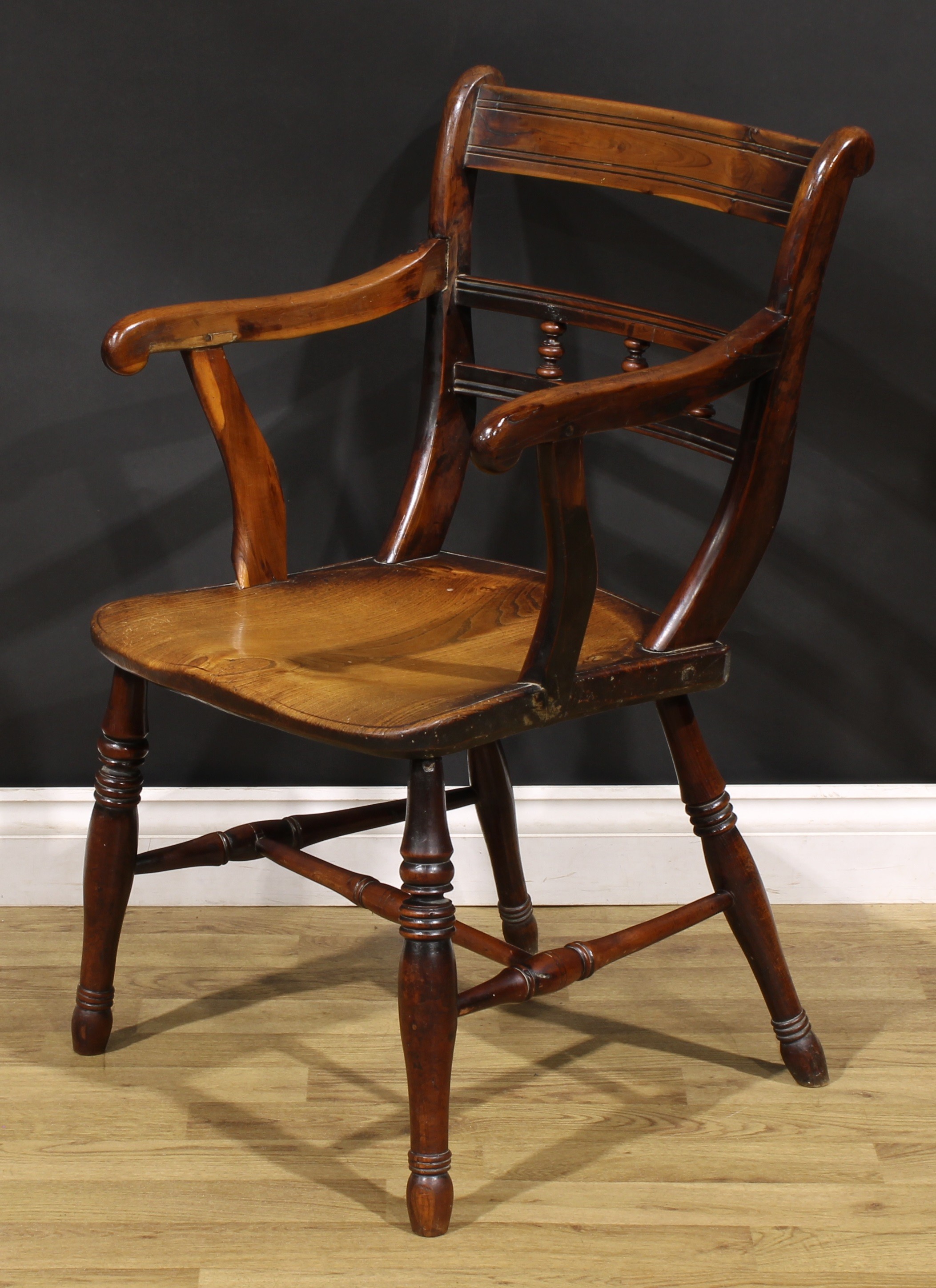An early 19th century yew and elm elbow chair, saddle seat, turned legs, H-stretcher, 86cm high, - Image 3 of 4