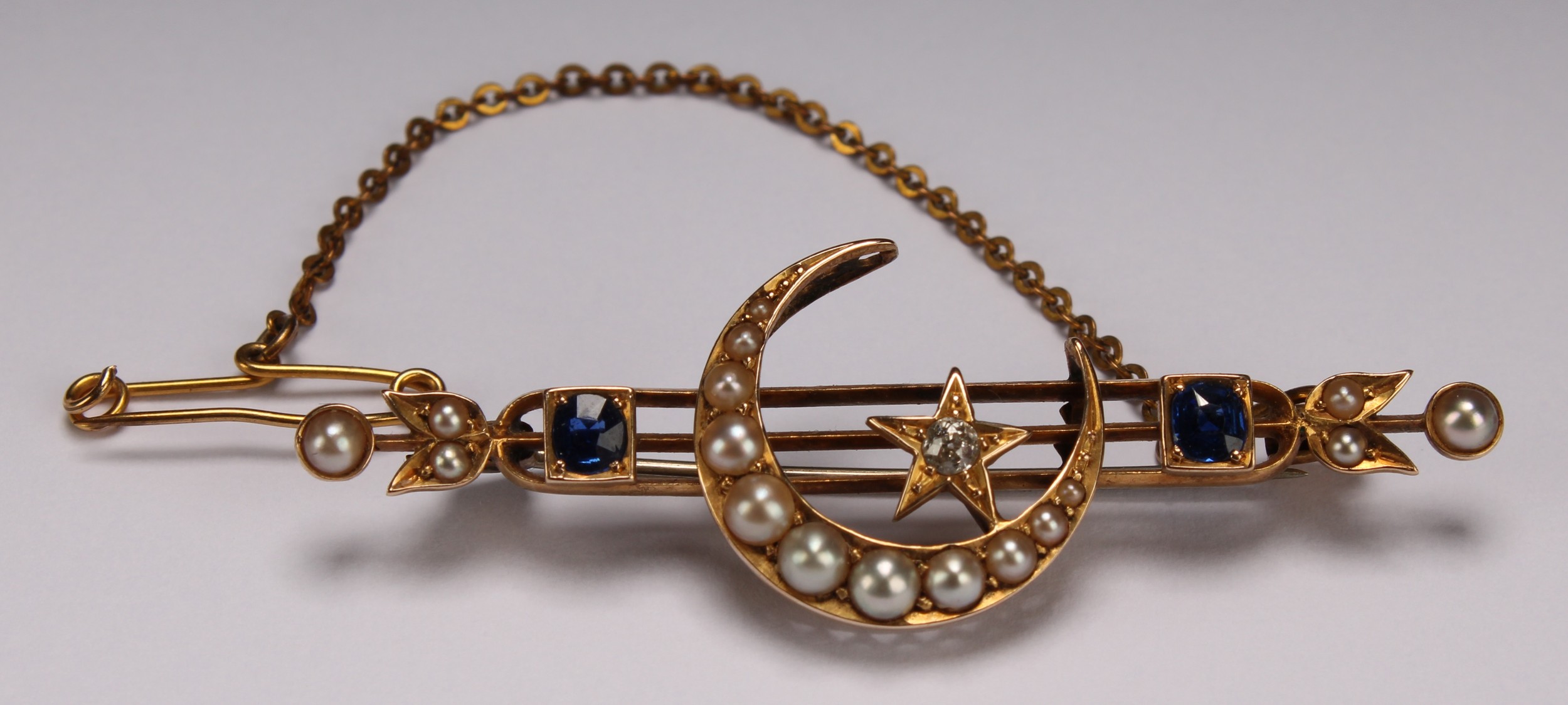 An Edwardian diamond, sapphire, seed pearl and yellow gold coloured metal brooch, centred by a - Image 2 of 4